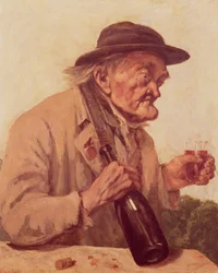 Alter Mann mit einem Glas Wein